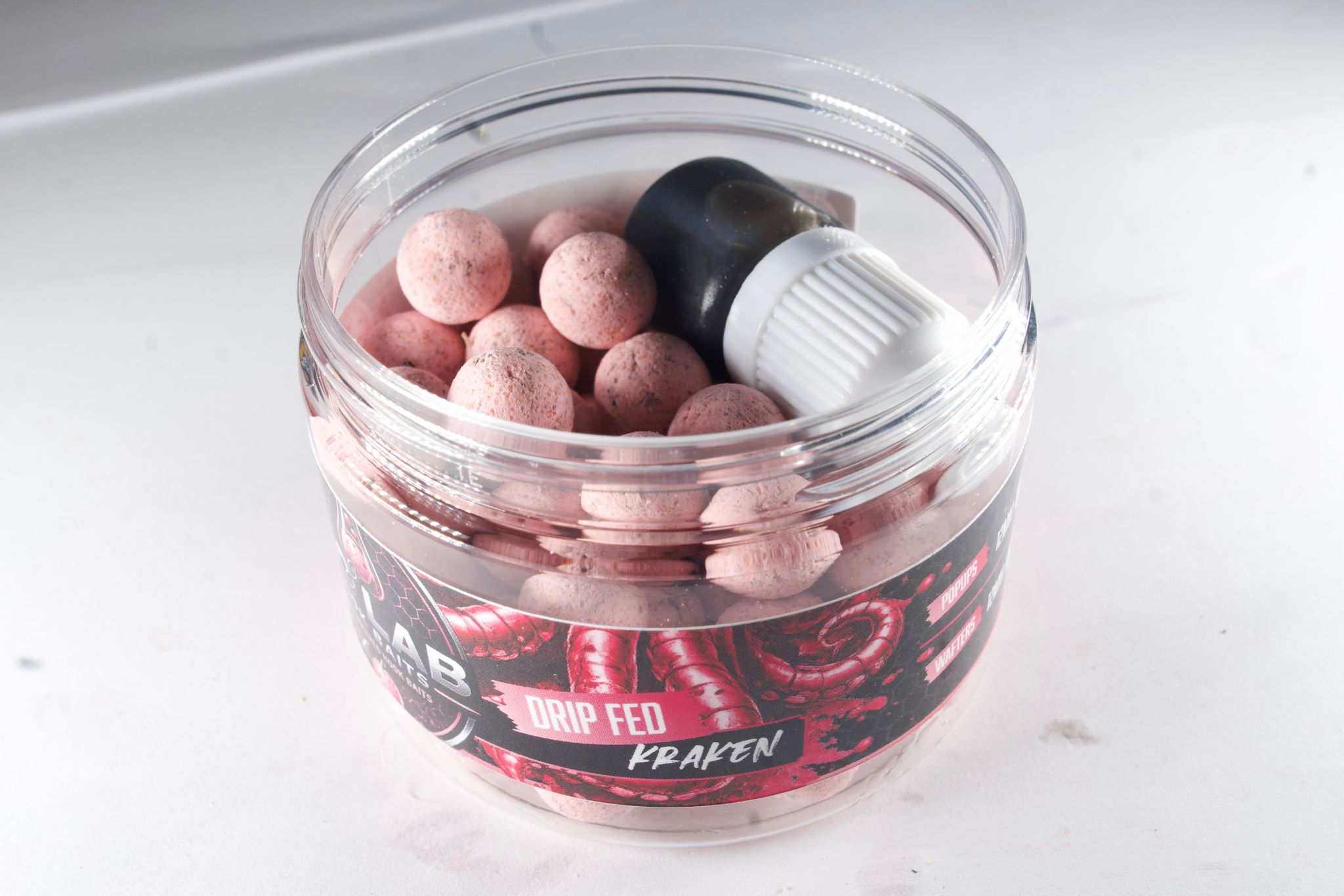Kraken Wafters &amp; Pop-Ups



Kraken is an ultra-premium marine hook bait, developed using an uncompromising blend of the finest aquatic proteins, marine extracts and nutritional feeding triggers available. Built around a rich squid and octopus profile, it delivers an intense natural food signal that appeals to even the biggest and most pressured carp.



Every hook bait is hand cured and drip-fed for months, allowing a powerful infusion of hydrolysed squid extract, octopus extract, fish protein hydrolysa